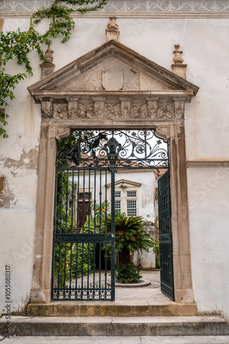 Entrance to the courtyard of Melos house in the center of Coimbra photo