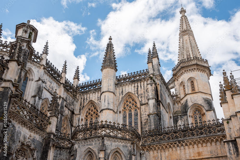 Picturesque detail of medieval Santa Maria da Vitoria monastery church in Batalha, a manueline gothic masterpiece, view on the southern facade Picturesque detail of medieval Santa Maria da Vitoria monastery church in Batalha, a manueline gothic masterpiece, view on the southern facade
