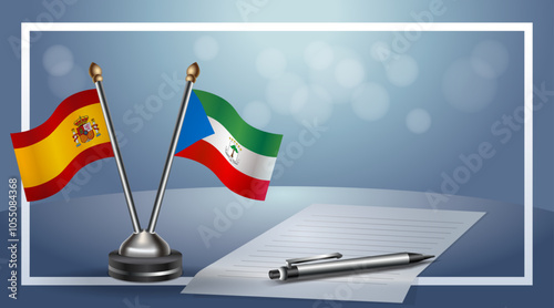 Spain and Equatorial Guinea Small national flag on bokeh background, cooperative relationship