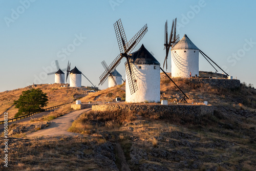 Iconic historic windmills in Consuegra at sunrise, Spain, known from Cervantes novel Don Quichotte