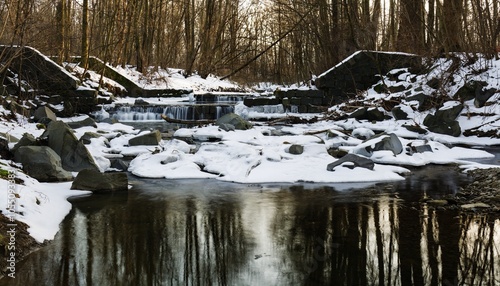 Crumbling weir in winter. Juhyne River. Eastern Moravia. Czechia.