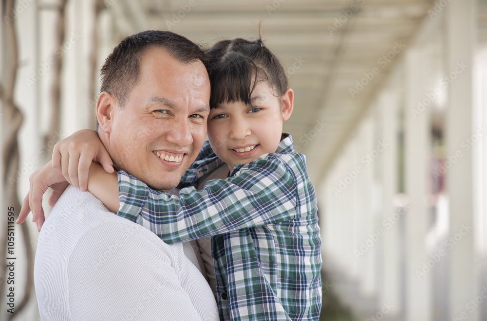 Happy smiling Asian father and daughter staying together, concept image for healthy family, good father, middle aged dad parenting, child development Happy smiling Asian father and daughter staying together, concept image for healthy family, good father, middle aged dad parenting, child development