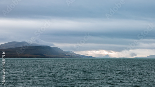 Wallpaper Mural Foggy coastal landscape in Svalbard showcasing serene waters and distant mountains Torontodigital.ca