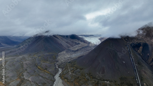 Stunning view of glaciers and mountains under cloud cover in Svalbards wild landscape