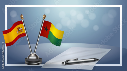 Spain and Guinea Bissau Small national flag on bokeh background, cooperative relationship