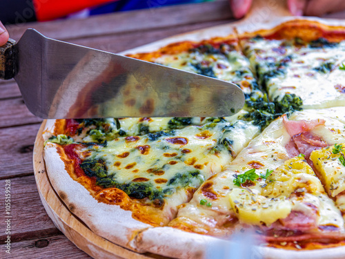 Pizza is cut into slices. Pizza is an Italian food and a type of fast food. It is a universal food that everyone makes and knows well.