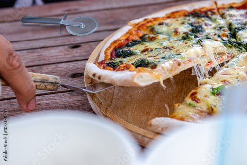 Pizza slices on a tray, eaten with seasonings, is an Italian fast food and is a universal food that everyone makes and knows all over the world.