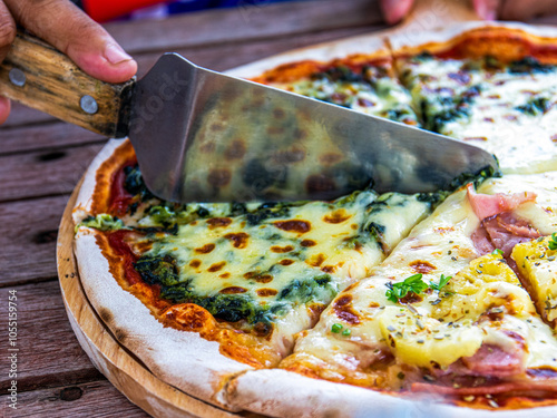 Pizza is cut into slices. Pizza is an Italian food and a type of fast food. It is a universal food that everyone makes and knows well.
