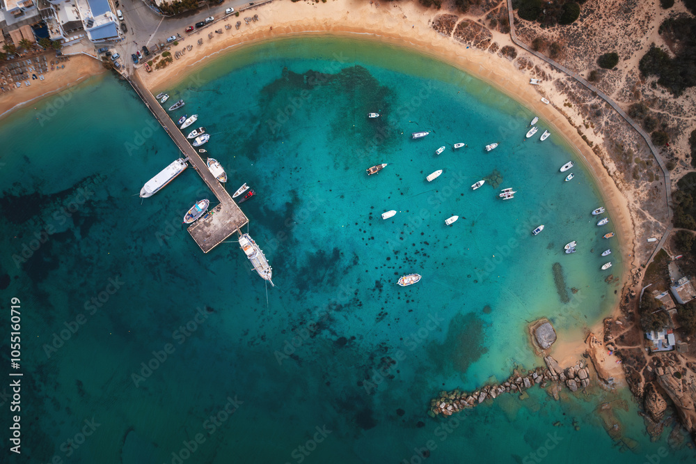 A stunning view of Naxos Island, Greece, featuring crystal-clear turquoise waters, rugged coastlines, and charming white-washed buildings. A picturesque paradise for travelers and sun-seekers.