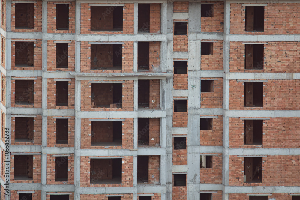 Exterior facede of an apartment building under construction Exterior facede of an apartment building under construction