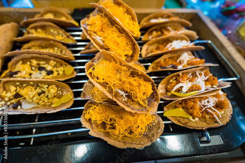 Golden Thai Crispy Pancakes Filled with Sweet Coconut Cream and Egg Yolk photo