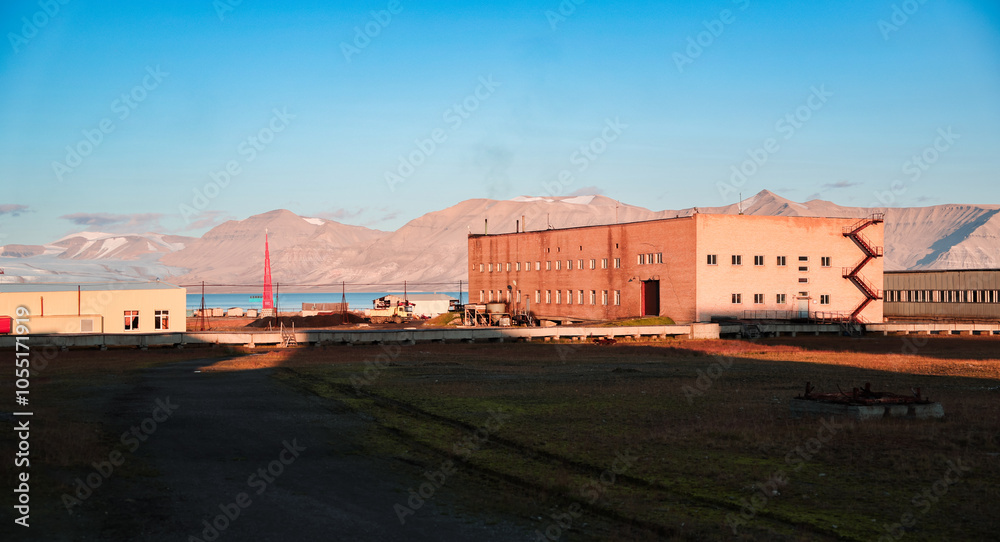 Exploring the abandoned buildings of Pyramiden in Svalbard during a sunny day Exploring the abandoned buildings of Pyramiden in Svalbard during a sunny day