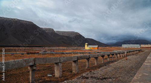 Exploring the remnants of Pyramiden in Svalbard during a cloudy day photo