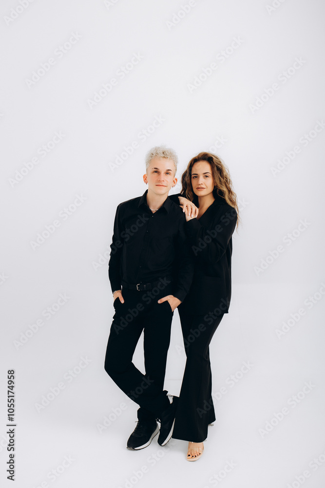 a guy and a girl in black suits on a white background a guy and a girl in black suits on a white background