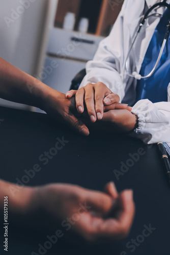 Kind male doctor wearing white coat consulting elder senior female patient holding hand of older woman giving help, safety, empathy and support, showing care and compassion concept. Close up view