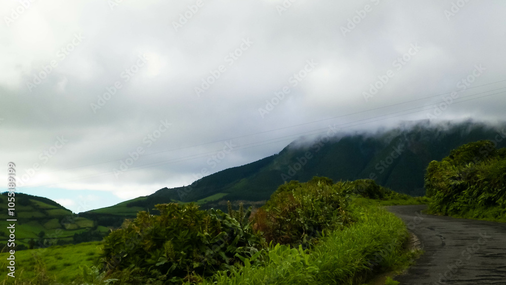 Typical landscape of Sao Miguel Island. Green Hills and rainy weather. Typical landscape of Sao Miguel Island. Green Hills and rainy weather.