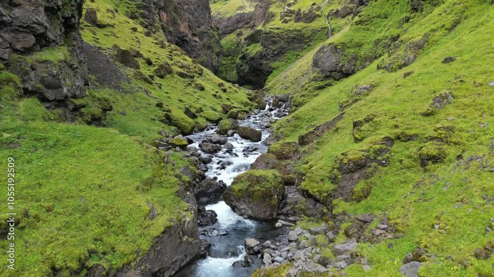Mountain river with big waterfall moss surrounded aerial flyby Mountain river with big waterfall moss surrounded aerial flyby