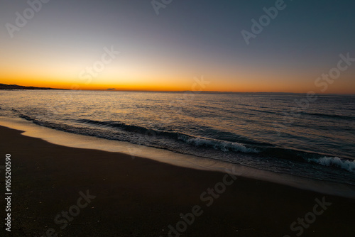 beautiful sunrise on the sea with waves