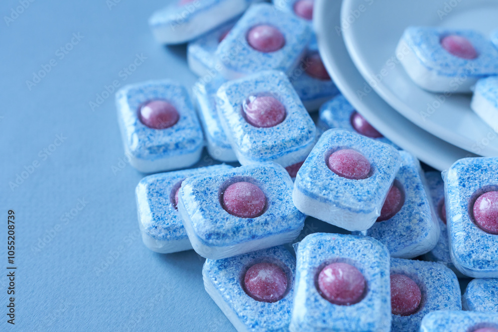 Dishwasher dishwashing capsules on a blue background. Dishwasher dishwashing capsules on a blue background.