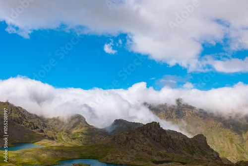 Rolling clouds over the mountain peaks and lakes. Landscape photo