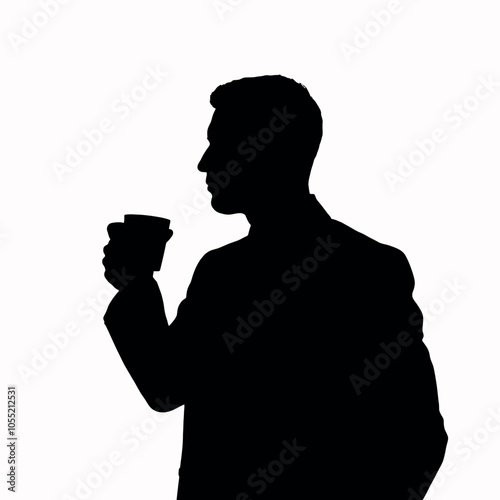 A businessman silhouette standing and drinking coffee, with one hand holding a coffee cup near his mouth