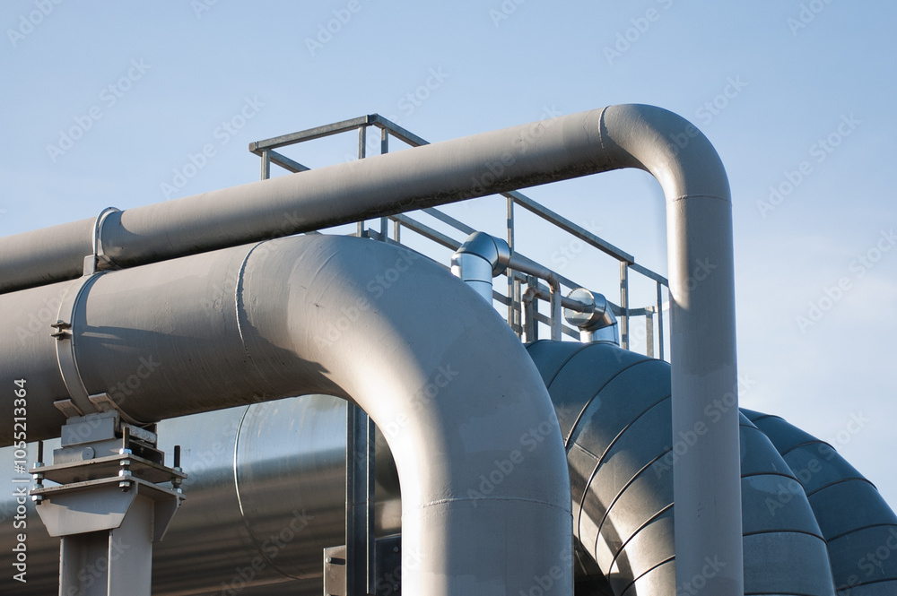 in the photo the road pipeline close-up against the blue sky in the photo the road pipeline close-up against the blue sky