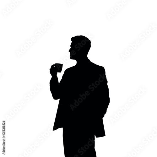 A businessman silhouette standing and drinking coffee, with one hand holding a coffee cup near his mouth