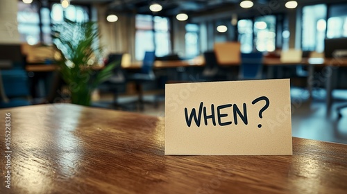 Wallpaper Mural In an office setting, a 'When?' card rests on a polished wooden table, inspiring an atmosphere of curiosity and introspection amidst modern design elements. Torontodigital.ca
