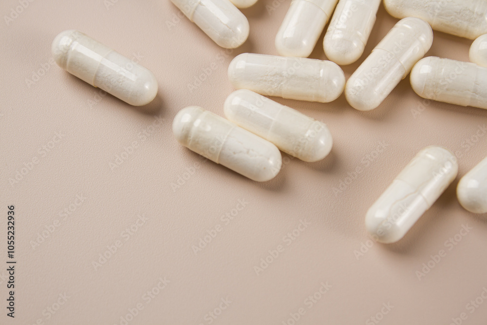 Vitamin capsules on a light background. Dietary supplements for health Vitamin capsules on a light background. Dietary supplements for health