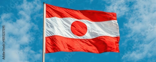 Close-up of the iconic Ohio State flag waving in the wind against a blue sky, Ohio state flag, Pride and symbolism photo