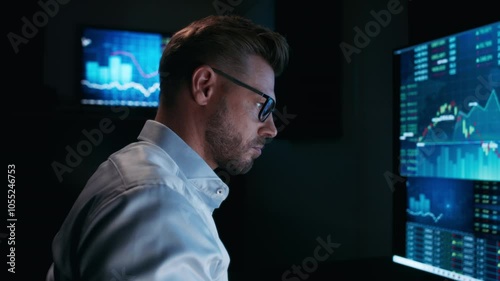 Stock market analyst working in front of computer screen