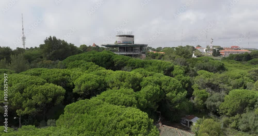 Aerial drone view of Lisbon’s Monsanto Park panoramic viewpoint with graffiti-covered abandoned architecture, perfect for urban exploration Aerial drone view of Lisbon’s Monsanto Park panoramic viewpoint with graffiti-covered abandoned architecture, perfect for urban exploration