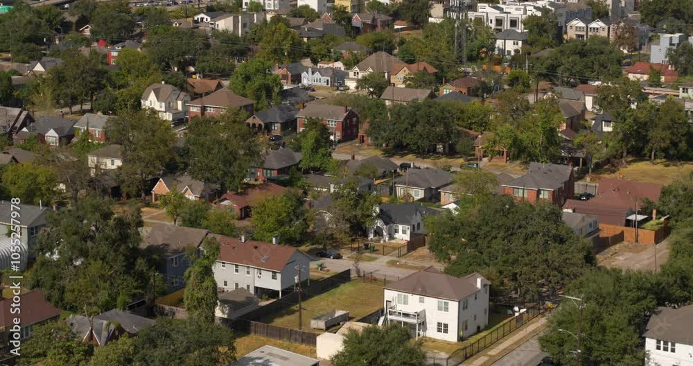 Drone shot of homes in Houston and revealing downtown area Drone shot of homes in Houston and revealing downtown area