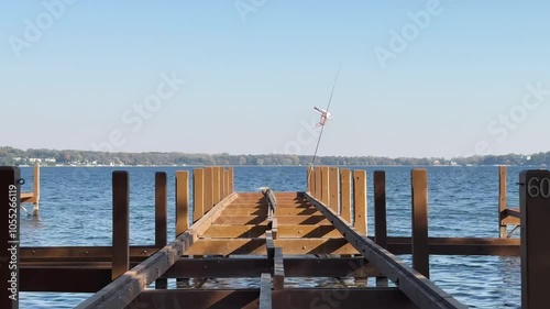 By Lake Geneva’s calm and clear water, stands an old, quaint wooden pier