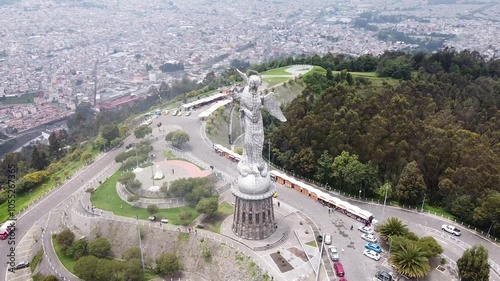 Aerial orbit of Panecillo Quito Capital City in the Andes mountains in Ecuador. Cityscape aerial orbit of famous statue in Ecuador