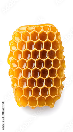 Golden honeycomb dripping with honey, isolated on white background.