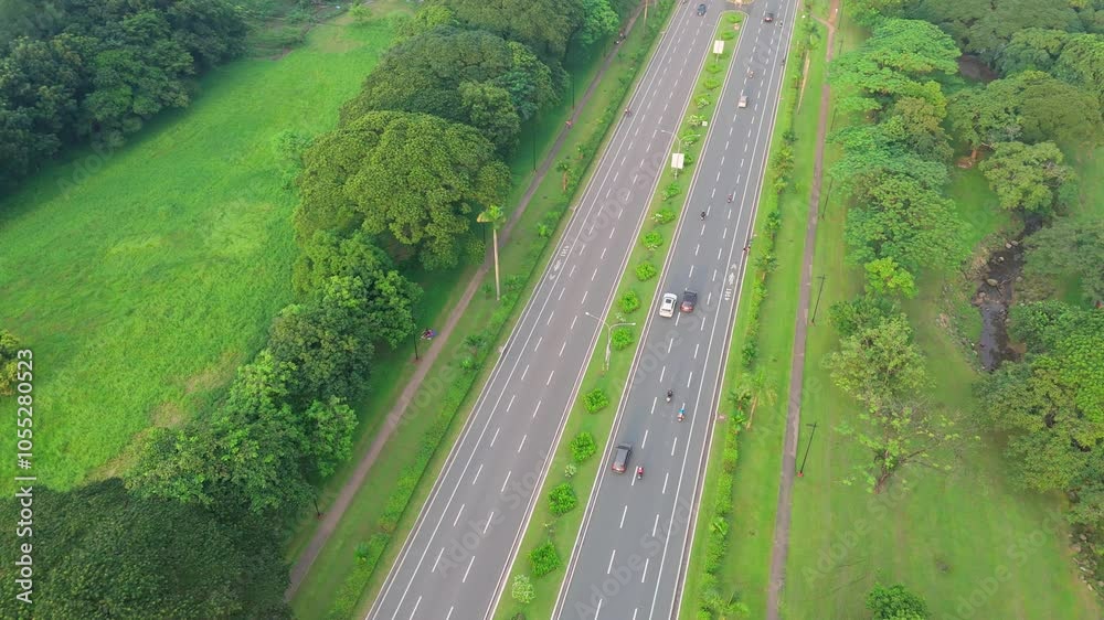 straight 6 lane road with trees on both side straight 6 lane road with trees on both side