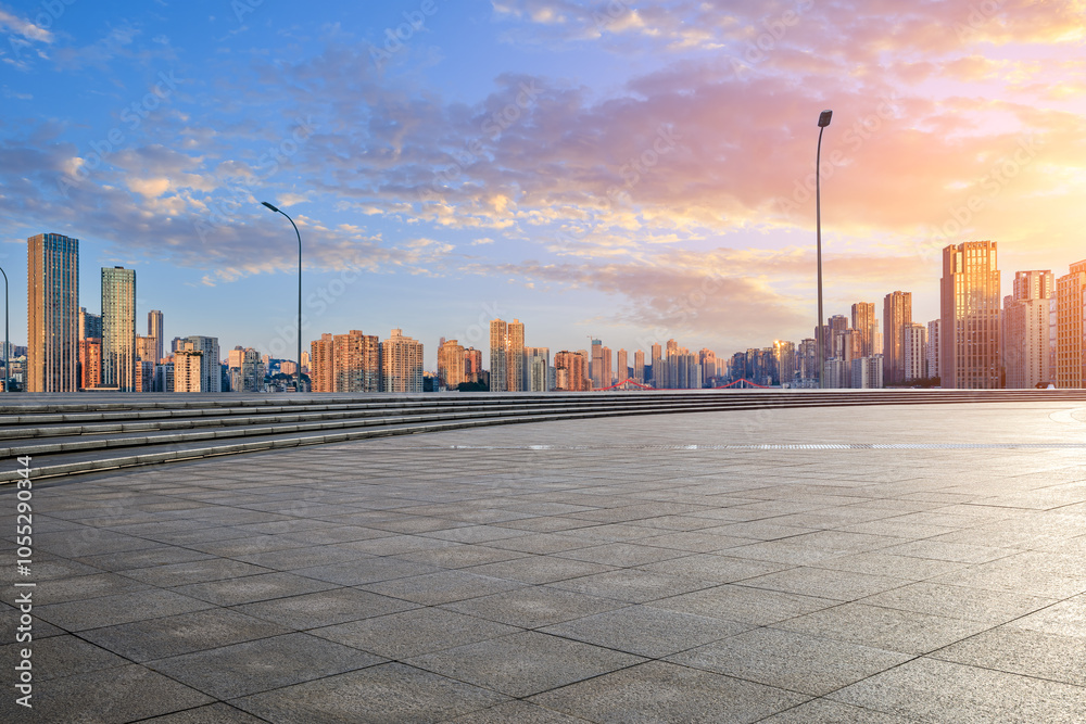 Empty square floor with modern residential area buildings scenery at sunset. car background.
