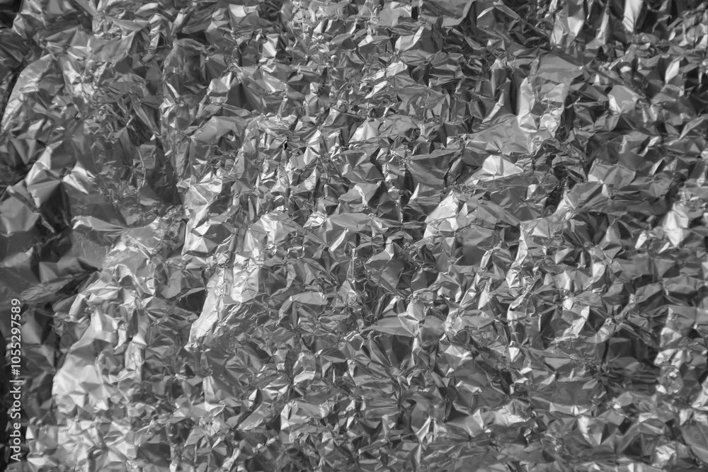 Processed collage of shiny metal silver gray foil crumpled packaging material texture Processed collage of shiny metal silver gray foil crumpled packaging material texture