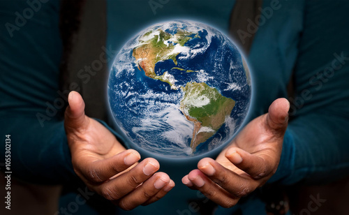 Two hands holding a realistic globe