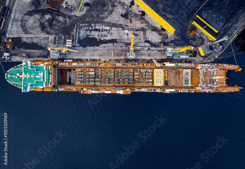 Aerial top view cargo ship with military equipment for transportation humanitarian aid, army forces for war