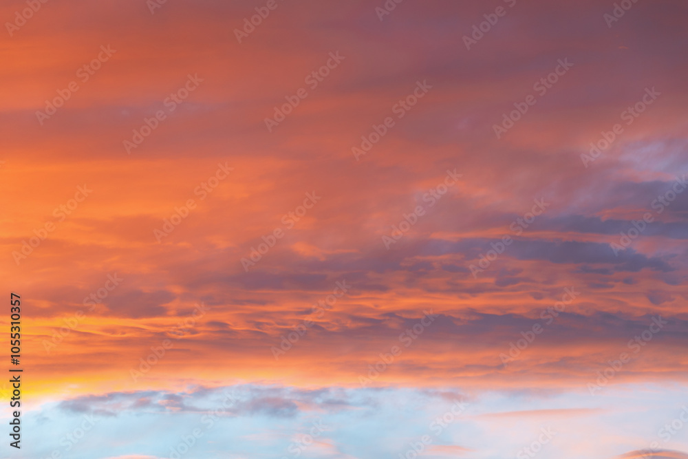 Beautiful sunset in the sky. Clouds of orange-pink hue. Beautiful sunset in the sky. Clouds of orange-pink hue.