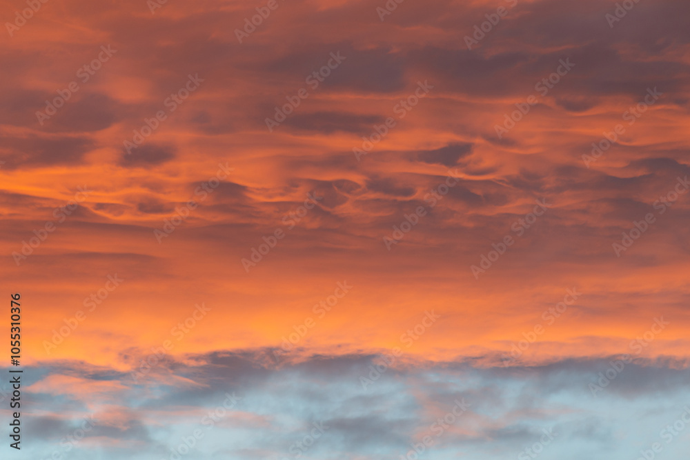 Beautiful sunset in the sky. Clouds of orange-pink hue. Beautiful sunset in the sky. Clouds of orange-pink hue.