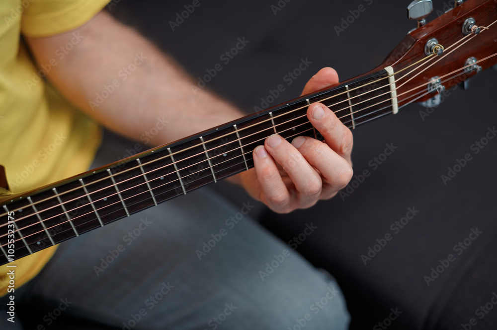 Guitarist on acoustic guitar playing melody. Close up musician instrument Guitarist on acoustic guitar playing melody. Close up musician instrument