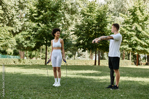 Two friends engage in an empowering workout session amidst the greenery, showcasing strength and camaraderie.