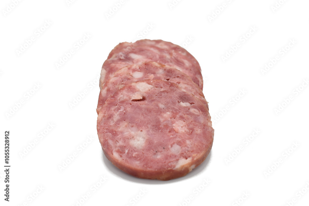 Salami sausage cut into rings and laid out in a row. Salami sausage cut into rings and laid out in a row.