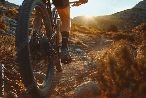 Mountain biking at sunset on rocky terrain in a scenic forest landscape