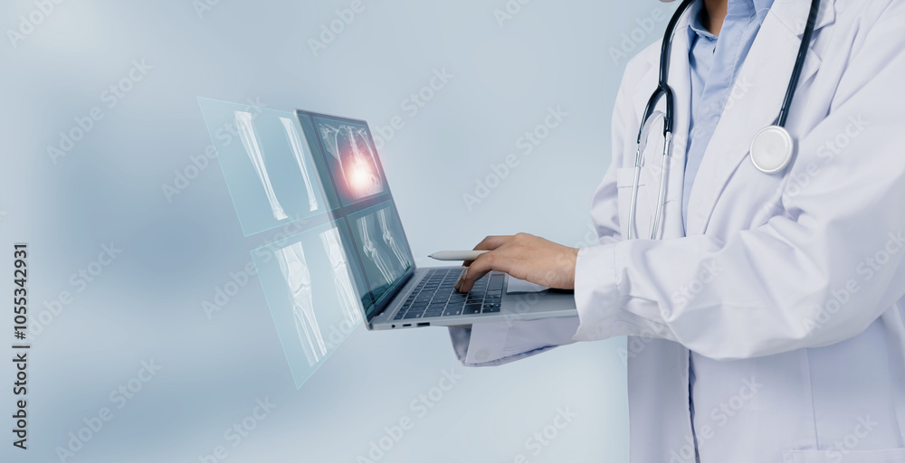 Female doctor using digital laptop and looking x-ray films, Medical and healthcare concept. Female doctor using digital laptop and looking x-ray films, Medical and healthcare concept.