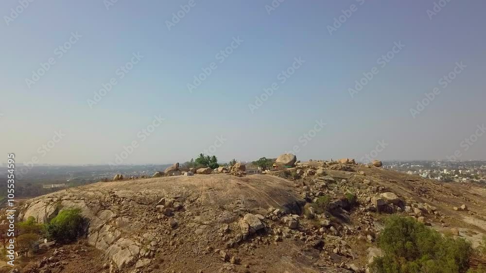 Aerial view of rocky Akkayamma Betta Hill at Bangalore during daytime in Karnataka. 4k. Skyscape. Aerial view of rocky Akkayamma Betta Hill at Bangalore during daytime in Karnataka. 4k. Skyscape.