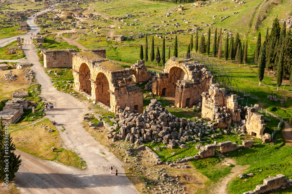 Aerial view of ancient ruins and scenic landscape with trees and a road, Pamukkale, Hierapolis, Turkey.